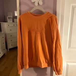 Orange crew neck sweatshirt